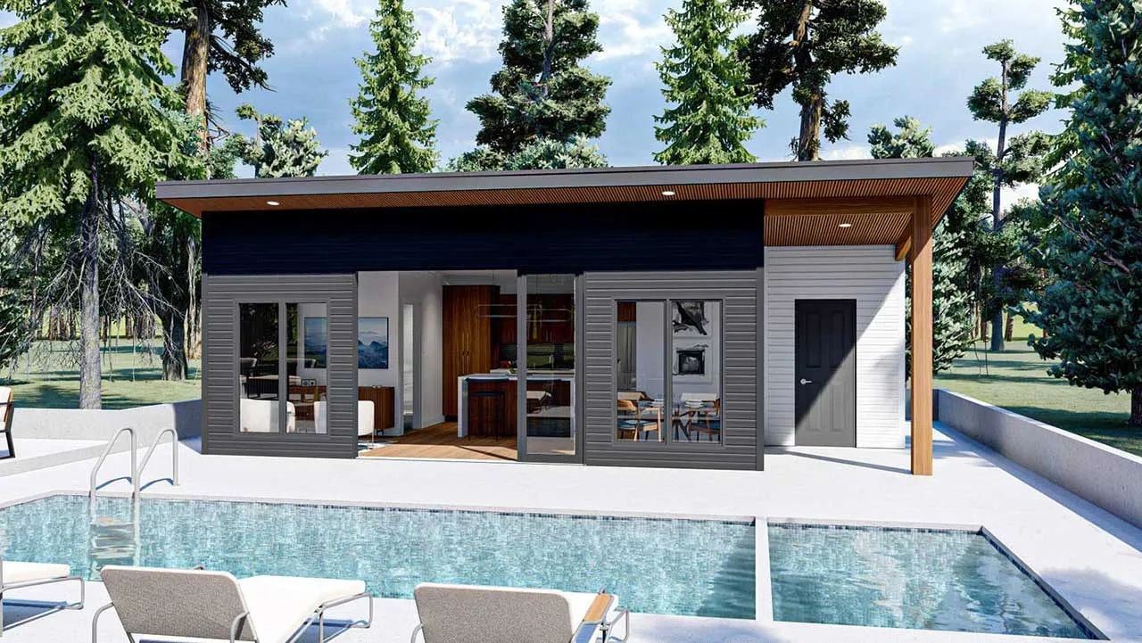 Modern pool house in a wooded setting